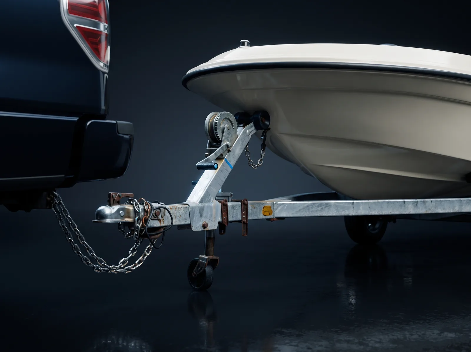 Galvanized boat trailer coupled to the hitch of a lifted pickup truck